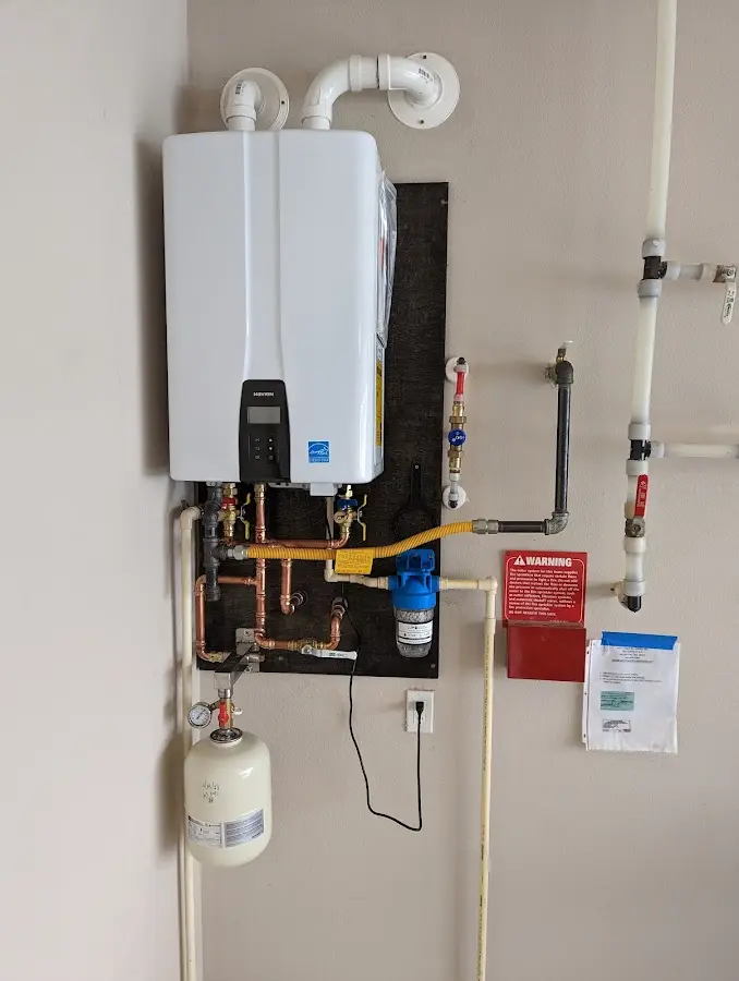 Professional plumber installing copper piping in a Irving home