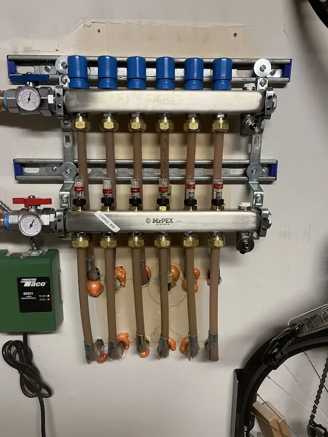 Plumber performing Water Heater Repair at a residential property in Irving